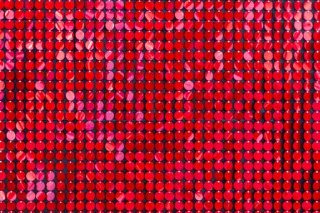 red background from sequins. brilliant photo zone. Christmas background. Valentine's day background. holiday conceptの写真素材
