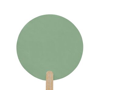 round gray green wooden plate on a wooden stick with copy space. isolated. banner for advertisingの写真素材