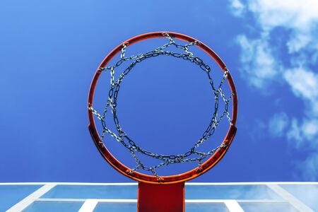 basketball hoop. bottom view of a basketball net from a metal chain. against the blue sky. copy spaceの写真素材