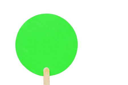 round green wooden plate on a wooden stick with copy space. isolated. banner for advertisingの写真素材
