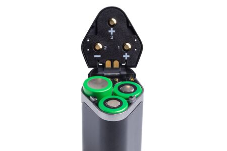18650 batteries in the battery compartment of an electronic vaping device. lithium-ion batteries are inserted in accordance with the polarity of the deviceの写真素材