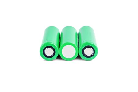 Three rechargeable batteries on a white background isolated. 18650 green batteries. device energy conceptの写真素材