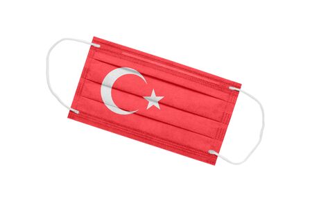 Medical mask with flag of Turkey isolated on a white background. Turkey pandemic concept. Attribute of coronavirus outbreak in Turkey. Medicine in Turkey.の写真素材