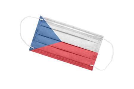 Medical face mask with Czech flag isolated on a white background. Czech pandemic concept. attribute of a coronavirus outbreak in the Czech Republic. Medicine in the Czech Republic.の写真素材