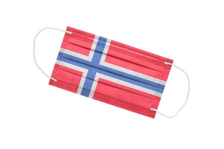 Medical mask with flag of norway isolated on white background. pandemic concept in norway. attribute of a coronavirus outbreak in Norway. Medicine in Norway.の写真素材