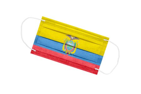 Medical mask with flag of Ecuador isolated on a white background. Ecuador pandemic concept. Coronavirus outbreak attribute in Ecuador. Medicine in Ecuador.の写真素材