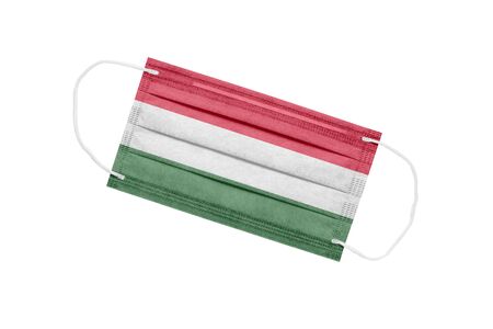 Medical mask with the flag of Hungary on a white background. The concept of the pandemic in Hungary. Coronavirus outbreak attribute in Hungary. Medicine in Hungary.の写真素材