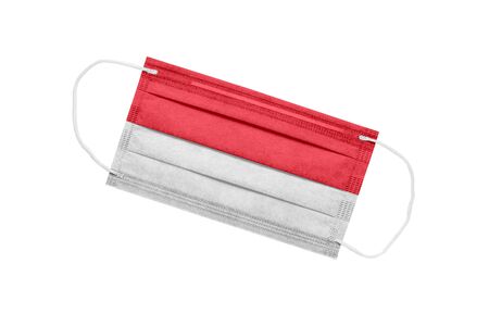 Medical mask with flag of indonesia isolated on white. Indonesia pandemic concept. Coronavirus outbreak attribute in Indonesia. Medicine in Indonesia.の写真素材