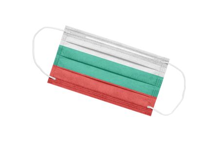 Medical mask with the flag of Bulgaria on a white background. The concept of a pandemic in Bulgaria. Attribute of a coronavirus outbreak in Bulgaria. Medicine in Bulgaria.の写真素材