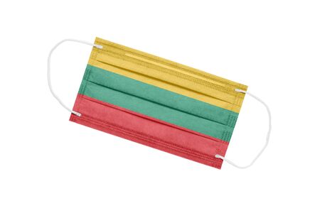 Medical mask with flag of Lithuania isolated on a white background. The concept of the pandemic in Lithuania. Attribute of a coronavirus outbreak in Lithuania. Medicine in Lithuania.の写真素材