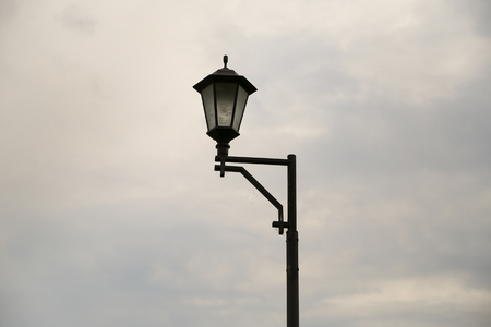 Street lamp in cloudy weather. Alone. cloudsの写真素材