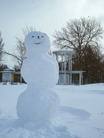 Big snowman in the city square after a snowfall