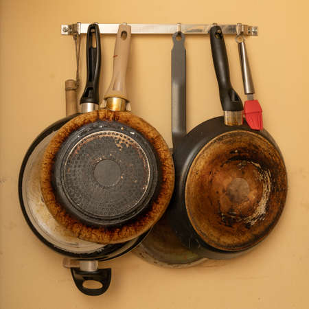 hung on the yellow wallhanging pans and kitchenwareの写真素材