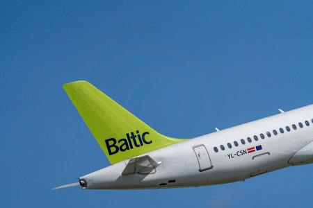 Marupe, Latvia - August 4, 2023 - Latvian AirBaltic airplanes rises into the air. visible The rear part of the aircraftのeditorial素材