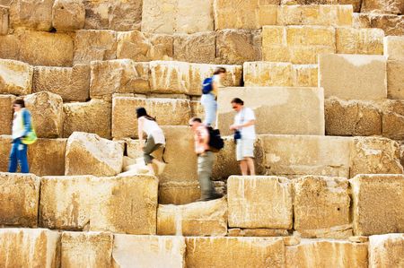 People walking on Pyramid in Egyptの写真素材
