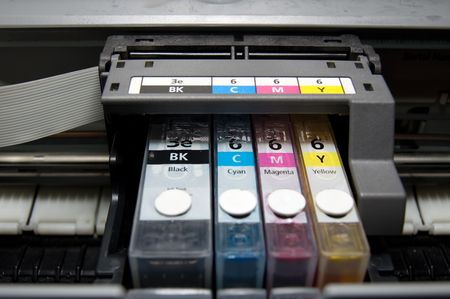 close-up shot of a CMYK ink cartridges for a color printerの写真素材