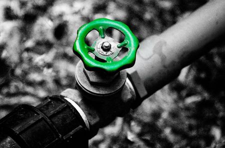 Green water valve and black&white background.の写真素材