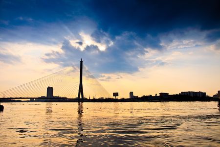 Suspension Bridge with dramatic clounds aboveの写真素材