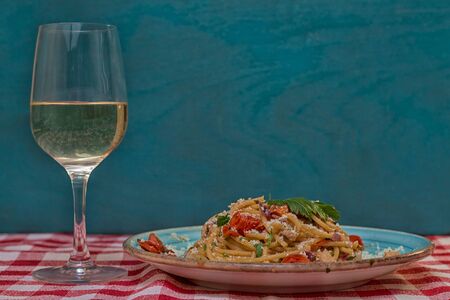 Spaghetti allAmatriciana glass of white wineの写真素材