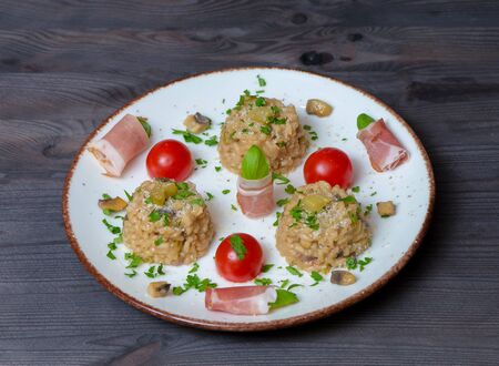 Rizotto cherry tomoatoes jamon parslay mushroomsの写真素材