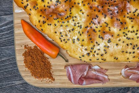 Bread lavash peper prochuto chilly wooden deskの写真素材