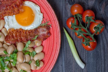 Farmer meals bean eggs bacon tomatto chilly garlicの写真素材