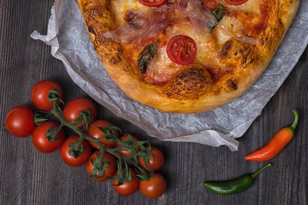 Pizza cherry chilly mozzarella prochutto pieceの写真素材