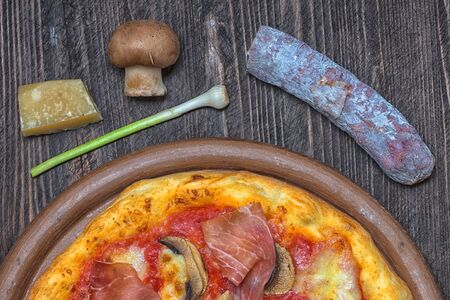 Pizza proscuitto funghi parmigiano chorizo onion rusticの写真素材