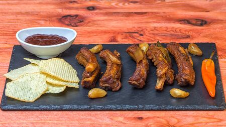 Ribs spinach chips garlic chilly red souceの写真素材