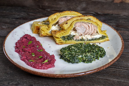 Salmon dough spinach pesto red mushの写真素材