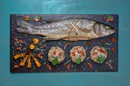 Fish with mushroom rizotto blackの写真素材