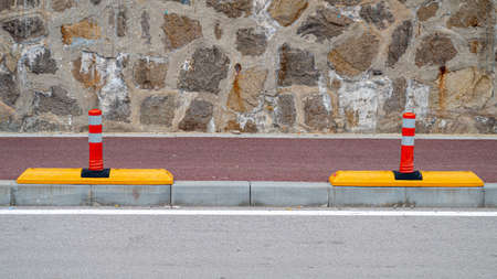 Bike lanes physical protection from car traffic safety postの写真素材