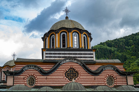 Monastery christian church dome foggy sky green treesの写真素材