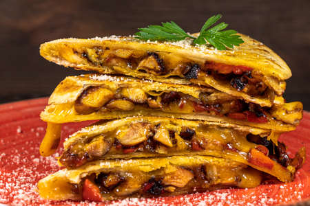 Quesadilla with Chicken Cheddar Cheese Red Pepper Close upの写真素材