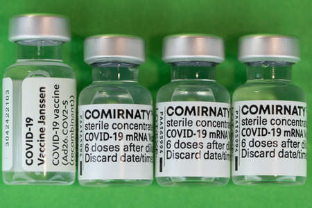 Comirnaty BioNTech Pfizer Janssen Covid-19 green backgroundのeditorial素材