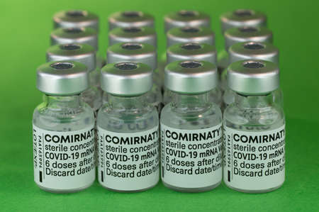 Comirnaty BioNTech Pfizer bottles Covid-19 white backgroundのeditorial素材