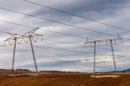 High voltage steel lattice towers foggy sky.の写真素材