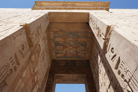 Ancient egyptian arch with hieroglyphs at the Temple of Ramses III, Luxor, Egyptの写真素材
