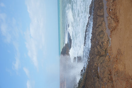 Waves splashing on cliffs in Cabo de la Vela, La Guajira, Colombia 2020の写真素材