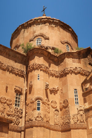The elaborate bas-relief, relief carvings on the facade of the Armenian Cathedral of the Holy Cross showing biblical scenes, Akdamar Island, Lake Van, Van Gの写真素材