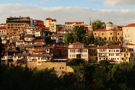 View at sunset, golden hour onto one of the neighborhoods of the old town of Veliko Tarnovo, Veliko Tarnovo, Bulgaria 2022の写真素材