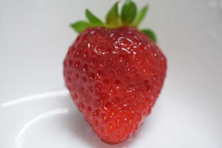 Asturian strawberry on a white plateの写真素材