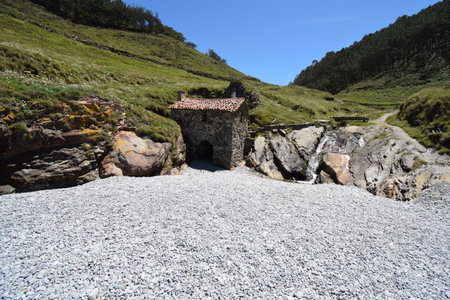 view of old mill in Vallina beach, Cudillero, Asturias, Spainの写真素材