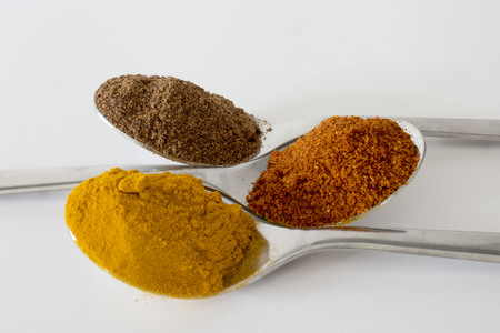 Spices in teaspoons on a white backgroundの写真素材
