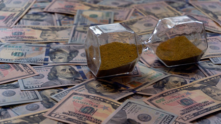 time is money concept hourglass with dollarsの写真素材