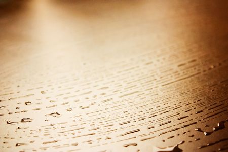 Water drops on a wooden tableの写真素材