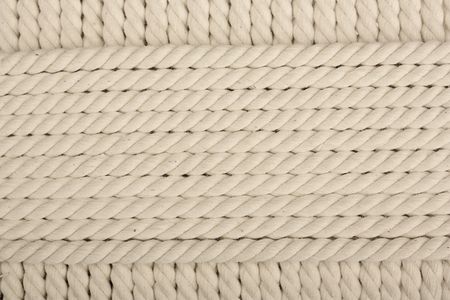 Heavy, white coiled rope.