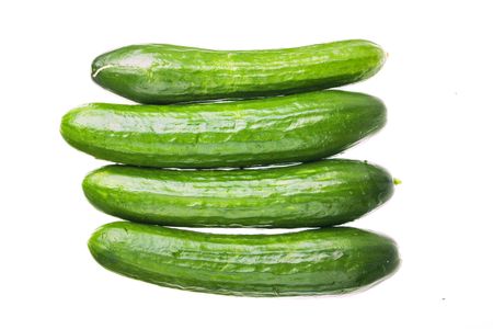 fresh cucumbers isolated on a white background の写真素材