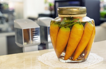 Glass jar with carrots in the interior of the cafe.の写真素材