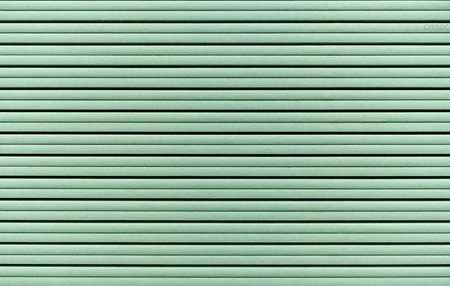 Background from sheets of green drywall. Materials for repair and construction.